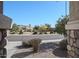 View of a neighborhood park with playground equipment from the entryway at 17338 W Woodrow Ln, Surprise, AZ 85388