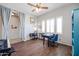 Bright home office features wood floors, a desk, and plenty of natural light at 17338 W Woodrow Ln, Surprise, AZ 85388