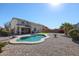 Inviting kidney-shaped pool with surrounding patio at 17338 W Woodrow Ln, Surprise, AZ 85388