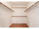 Walk-in closet with double hanging rods and shelving at 18881 N 91St Dr, Peoria, AZ 85382