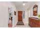 Bright entryway with hardwood floors and wooden console table at 18881 N 91St Dr, Peoria, AZ 85382