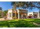 Single-story home with a covered patio and well-manicured lawn at 18881 N 91St Dr, Peoria, AZ 85382