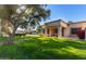 Single story home with covered patio and lush green lawn at 18881 N 91St Dr, Peoria, AZ 85382