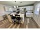 A bright kitchen features stainless steel appliances, a center island with seating, and quartz countertops at 1922 N 25Th St, Phoenix, AZ 85008