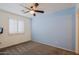 Bedroom with ceiling fan and blue accent wall at 19624 N 16Th Dr, Phoenix, AZ 85027