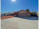 House exterior with a large driveway, solar panels and landscaping at 19624 N 16Th Dr, Phoenix, AZ 85027