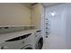 Laundry room with washer, dryer, and extra shelving at 19624 N 16Th Dr, Phoenix, AZ 85027