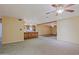 Open living room with tile flooring and kitchen view at 19624 N 16Th Dr, Phoenix, AZ 85027