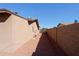 Side yard with gravel ground and a block wall at 19624 N 16Th Dr, Phoenix, AZ 85027