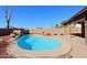 Relaxing kidney-shaped pool with patio and seating area at 19624 N 16Th Dr, Phoenix, AZ 85027