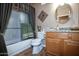 Guest bathroom with tub shower and granite vanity at 20825 N Limousine Dr, Sun City West, AZ 85375