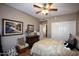 Well-lit bedroom with double doors leading to another room at 20825 N Limousine Dr, Sun City West, AZ 85375