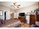 Large bedroom with walk-in closet and wood floors at 20825 N Limousine Dr, Sun City West, AZ 85375