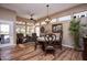 Bright dining area with wood floors and large windows at 20825 N Limousine Dr, Sun City West, AZ 85375