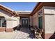 Front entry with double doors and seating at 20825 N Limousine Dr, Sun City West, AZ 85375