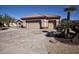 Three-car garage with paver driveway and mature landscaping at 20825 N Limousine Dr, Sun City West, AZ 85375