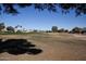 View of a golf course from behind the home, showing landscape and houses at 20825 N Limousine Dr, Sun City West, AZ 85375