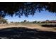 View of a lush green golf course with homes in the background at 20825 N Limousine Dr, Sun City West, AZ 85375