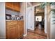 Hallway with wood cabinets and view to guest bedroom at 20825 N Limousine Dr, Sun City West, AZ 85375