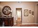 Long hallway with wood flooring and framed artwork at 20825 N Limousine Dr, Sun City West, AZ 85375