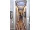 A long hallway with light walls and wood floors at 20825 N Limousine Dr, Sun City West, AZ 85375