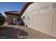 Home's exterior side showcasing AC unit and storage area at 20825 N Limousine Dr, Sun City West, AZ 85375