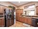 Modern kitchen with stainless steel appliances and wood cabinets at 20825 N Limousine Dr, Sun City West, AZ 85375