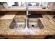 Stainless steel double kitchen sink with granite countertop at 20825 N Limousine Dr, Sun City West, AZ 85375