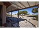 Relaxing patio with covered pergola and lush landscaping at 20825 N Limousine Dr, Sun City West, AZ 85375