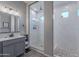 Spa-like bathroom featuring a double shower and gray vanity at 21097 E Sparrow Dr, Queen Creek, AZ 85142