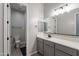 Modern bathroom with gray vanity, white countertop, and updated fixtures at 21097 E Sparrow Dr, Queen Creek, AZ 85142