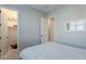 Cozy bedroom with a queen-size bed and access to closet and bath at 21097 E Sparrow Dr, Queen Creek, AZ 85142