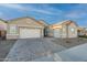 Stunning curb appeal with a modern facade and well-manicured landscaping at 21097 E Sparrow Dr, Queen Creek, AZ 85142