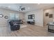 Relaxing living room with sectional sofa and wood floors at 21097 E Sparrow Dr, Queen Creek, AZ 85142