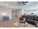 Open living room, featuring a large sectional sofa at 21097 E Sparrow Dr, Queen Creek, AZ 85142