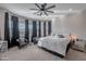 Main bedroom with ceiling fan and large windows at 21097 E Sparrow Dr, Queen Creek, AZ 85142