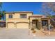 Two-story house with three-car garage, landscaping, and a for sale sign at 2128 E Leo Pl, Chandler, AZ 85249