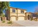 Two-story house with a three-car garage and landscaped yard at 2128 E Leo Pl, Chandler, AZ 85249