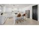 Modern white kitchen with a large island, stainless steel appliances, and gold accents at 2128 E Leo Pl, Chandler, AZ 85249