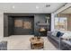 Living room with gray sofas, fireplace, and a modern coffee table at 2128 E Leo Pl, Chandler, AZ 85249