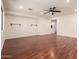 Bright living room featuring hardwood floors and a ceiling fan at 2128 E Leo Pl, Chandler, AZ 85249