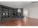 Relaxing living room with fireplace, built-in shelving, and hardwood floors at 2128 E Leo Pl, Chandler, AZ 85249