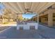 Outdoor kitchen area with a pergola and built-in grill at 2128 E Leo Pl, Chandler, AZ 85249