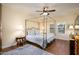 Spacious bedroom with a four-poster bed and wood floors at 21320 N 56Th St # 1175, Phoenix, AZ 85054