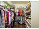 Walk-in closet with ample hanging space and shelving at 21320 N 56Th St # 1175, Phoenix, AZ 85054