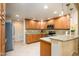 Modern kitchen with granite countertops and wood cabinetry at 21320 N 56Th St # 1175, Phoenix, AZ 85054