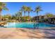 Inviting community pool with palm trees and comfortable lounge chairs at 21320 N 56Th St # 1175, Phoenix, AZ 85054