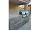 Outdoor kitchen with built-in grill and tile countertops at 2172 W Pinkley Ave, Coolidge, AZ 85128