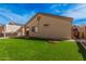 Beautiful backyard featuring green artificial grass, providing a perfect outdoor relaxation and entertainment space at 2172 W Pinkley Ave, Coolidge, AZ 85128