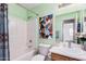 Bathroom featuring a shower-tub combo, a toilet, a sink and a vanity at 2172 W Pinkley Ave, Coolidge, AZ 85128